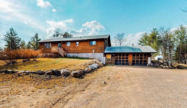 Quiet lakefront home with dock, canoe, & sunroom - dog-friendly