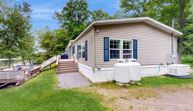 Renovated waterfront home with amazing views, dock, yard games & fireplace