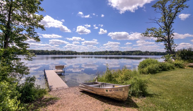 Riverfront cabin with kayaks and canoes