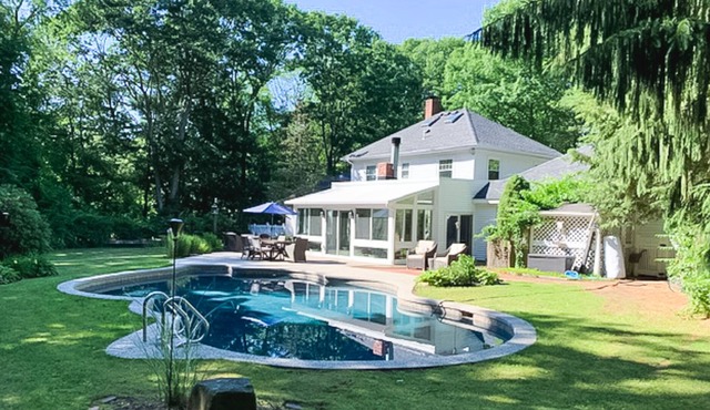 Seacoast home with private pool, sunroom, patio, grill, firepit, & fireplace