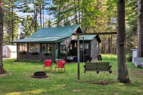 Secluded Cabin Nestled Amidst Trees and Fire Pit Provided in Hazelhurst, Wisconsin