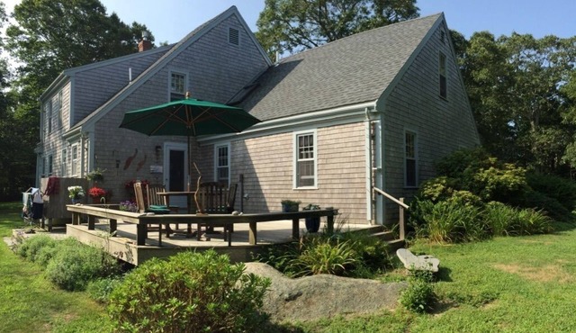 Secluded house in the woods with deck, streamside firepit, Vincent Beach nearby