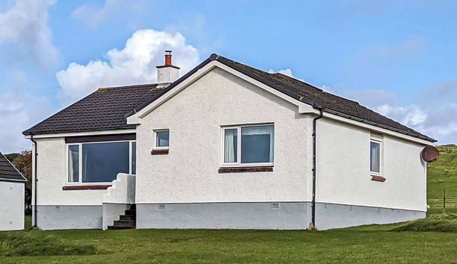 This detached bungalow is just minutes’ walk from a sandy beach.