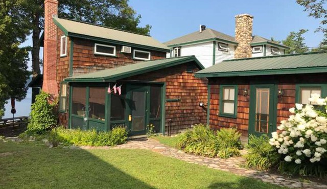 Tranquil cottage near beach with private dock, spacious patio & modern comforts