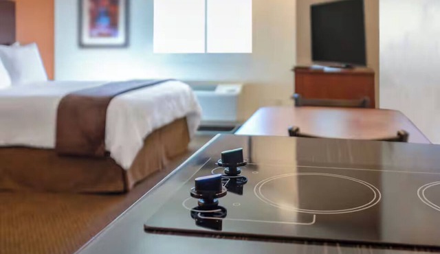 Triple Delight in Grand Forks – Queen Bed + Recliner Units Perfect for Friends