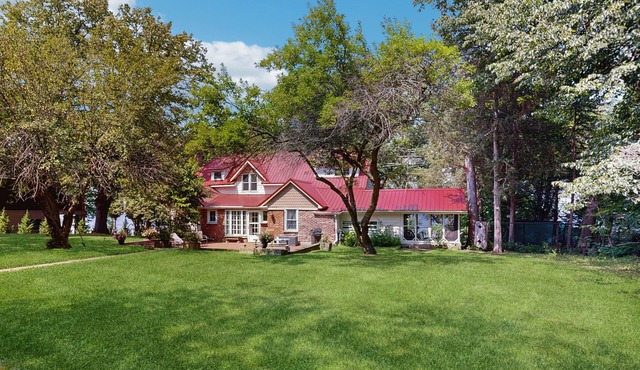 Victorian all-suite lakefront house with pier, piano, & wood fireplace