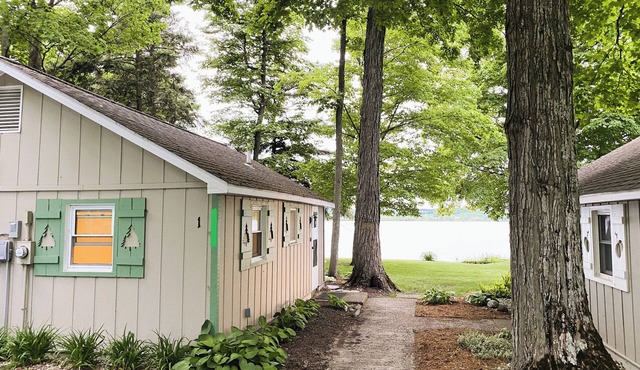 Waterfront directly on Lake Leelanau!Cottage with beach and fire pits!
