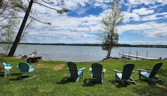 Waterfront log home on Elk Lake with dock and mooring, window A/C. Dog ok.