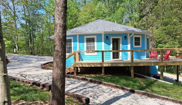 Whispering Pines is a lovely 3-bedroom family-friendly home in a wooded setting.
