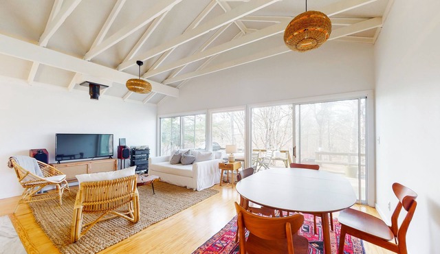 Woodsy island home with large deck, open layout, WiFi, kitchen & ideal location